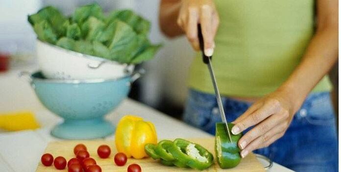 Preparing a vegetable salad for dinner according to the principles of proper nutrition for a slim figure